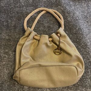Michael Kors gold drawstring bag used good condition.